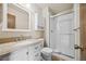 Bathroom featuring a vanity with granite countertop and a glass-enclosed shower at 250 Cypress Ln, Broomfield, CO 80020