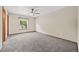 Comfortable bedroom with neutral tones, carpet flooring, and a window at 250 Cypress Ln, Broomfield, CO 80020