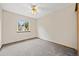 Bright, empty bedroom showcasing natural light and a ceiling fan at 250 Cypress Ln, Broomfield, CO 80020
