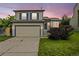 Charming two-story home with a well-manicured lawn, two-car garage, and beautiful exterior paint at 250 Cypress Ln, Broomfield, CO 80020