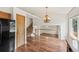 Open-concept living area with wood floors and a staircase leading to the upper level at 250 Cypress Ln, Broomfield, CO 80020