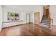 Bright living room with hardwood floors and large windows allowing for plenty of natural light at 250 Cypress Ln, Broomfield, CO 80020