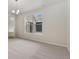 Bedroom featuring new carpeting and a large window that brings in natural light at 323 Josef Cir, Fort Lupton, CO 80621