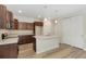 Well-appointed kitchen with modern appliances, a center island, and ample cabinet space at 323 Josef Cir, Fort Lupton, CO 80621