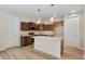 Modern kitchen with stainless steel appliances, center island, and plenty of storage at 323 Josef Cir, Fort Lupton, CO 80621