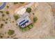 Aerial view of a house with solar panels on the roof, trees, and a circular driveway at 481 Sunrise Dr, Golden, CO 80401
