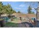 Backyard landscape design with seating, fire pit and mature trees at 481 Sunrise Dr, Golden, CO 80401