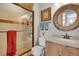Beautiful bathroom featuring vanity with custom mirror and walk in shower at 481 Sunrise Dr, Golden, CO 80401