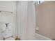 Neutral bathroom featuring a toilet and bathtub with tiled wall and shower curtain at 481 Sunrise Dr, Golden, CO 80401
