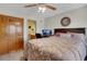 Comfortable bedroom featuring a large bed, a desk, and a double-door closet at 481 Sunrise Dr, Golden, CO 80401