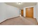 Carpeted bedroom with double closet and doorway to another room at 481 Sunrise Dr, Golden, CO 80401