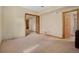 Spacious room with neutral walls, wall-to-wall carpet and two doorways at 481 Sunrise Dr, Golden, CO 80401