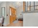 Inviting entryway featuring a wood door, wood flooring, and a decorative light fixture at 481 Sunrise Dr, Golden, CO 80401