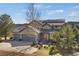 Charming home with a two-car garage, solar panels, and beautiful front yard landscaping and outdoor seating at 481 Sunrise Dr, Golden, CO 80401