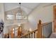 Elegant foyer with a decorative chandelier and staircase with wood and iron railing at 481 Sunrise Dr, Golden, CO 80401