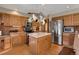 Well-equipped kitchen with stainless steel appliances, island, and beautiful countertops and a pot rack above at 481 Sunrise Dr, Golden, CO 80401