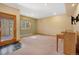 Inviting living room featuring large windows, neutral walls and carpet and piano in corner at 481 Sunrise Dr, Golden, CO 80401