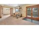 Recreation room with exercise equipment and glass doors to patio with scenic view at 481 Sunrise Dr, Golden, CO 80401