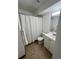 Bathroom with a shower, toilet, vanity and a storage closet for linens at 4400 S Quebec St # 102R, Denver, CO 80237