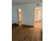Clean bedroom with hardwood floors and access to the closet space at 4400 S Quebec St # 102R, Denver, CO 80237