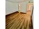 Well-lit bedroom with wood floors and two entry ways at 4400 S Quebec St # 102R, Denver, CO 80237