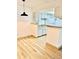 Bright dining area with wood flooring adjacent to the kitchen at 4400 S Quebec St # 102R, Denver, CO 80237
