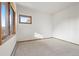 Neutral carpeted bedroom with a mountain view at 29011 Upper Moss Rock Rd, Golden, CO 80401