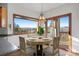 Inviting dining area featuring scenic views, modern lighting, and comfortable seating for elegant meals at 29011 Upper Moss Rock Rd, Golden, CO 80401