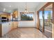 Bright dining area featuring scenic views, deck access, and pendant lighting at 29011 Upper Moss Rock Rd, Golden, CO 80401