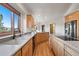 Bright kitchen with granite countertops, wood cabinetry, stainless steel appliances, and a scenic view at 29011 Upper Moss Rock Rd, Golden, CO 80401