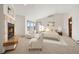 Serene main bedroom boasting a fireplace, scenic views, and a sitting area for relaxation at 29011 Upper Moss Rock Rd, Golden, CO 80401