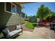 A serene backyard featuring a patio, privacy fence, and lush greenery, perfect for outdoor relaxation at 4520 S Delaware St, Englewood, CO 80110