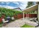 Private backyard featuring a brick patio with outdoor seating, perfect for entertaining at 4520 S Delaware St, Englewood, CO 80110