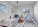 Charming bedroom with hardwood floors, a bed, and a decorative play tent at 4520 S Delaware St, Englewood, CO 80110