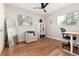 Bright bedroom with hardwood floors, ceiling fan, and lots of natural light at 4520 S Delaware St, Englewood, CO 80110