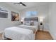 Comfortable bedroom featuring a bed with decorative pillows and side tables with lamps at 4520 S Delaware St, Englewood, CO 80110