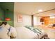 Bright bedroom featuring stylish decor, modern entertainment center, and a comfortable bed at 4520 S Delaware St, Englewood, CO 80110