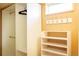An organized closet space featuring shelving, hanging rods and hooks for maximum storage at 4520 S Delaware St, Englewood, CO 80110