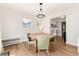 Cozy dining room with wood table, stylish green chairs and decorative lighting at 4520 S Delaware St, Englewood, CO 80110