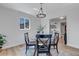 A bright dining room with a glass table and decorative lighting at 4520 S Delaware St, Englewood, CO 80110
