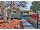 Charming home with a well-manicured front yard and inviting curb appeal at 4520 S Delaware St, Englewood, CO 80110