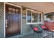 Inviting front porch featuring comfortable seating and a view of the well-maintained neighborhood at 4520 S Delaware St, Englewood, CO 80110
