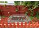 Backyard garden is protected by a red wooden fence at 4520 S Delaware St, Englewood, CO 80110