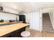 Basement kitchen with butcher block island and updated appliances at 4520 S Delaware St, Englewood, CO 80110