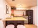 A cozy kitchenette with modern appliances and a wood countertop at 4520 S Delaware St, Englewood, CO 80110