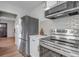Well-appointed kitchen with stainless steel appliances and white subway tile backsplash at 4520 S Delaware St, Englewood, CO 80110