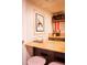 Charming kitchenette with butcher block countertop, cute backsplash, and modern appliances at 4520 S Delaware St, Englewood, CO 80110