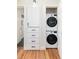 Convenient laundry area with stacked washer and dryer and extra storage at 4520 S Delaware St, Englewood, CO 80110