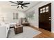 Inviting living room with ceiling fan, hardwood floors, ample natural light, and modern decor at 4520 S Delaware St, Englewood, CO 80110