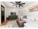 Well-lit living room showcasing hardwood floors, modern furniture, and a media console with TV at 4520 S Delaware St, Englewood, CO 80110